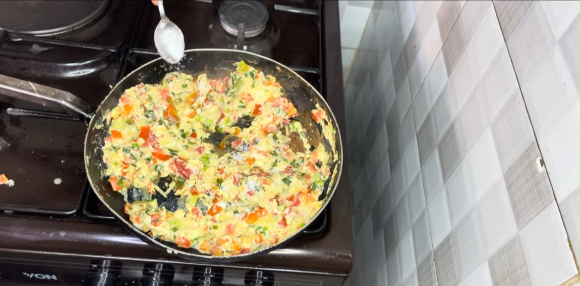 Step 1.1: Fold the omelette in half or leave it open-faced, then cook for another minute until fully set