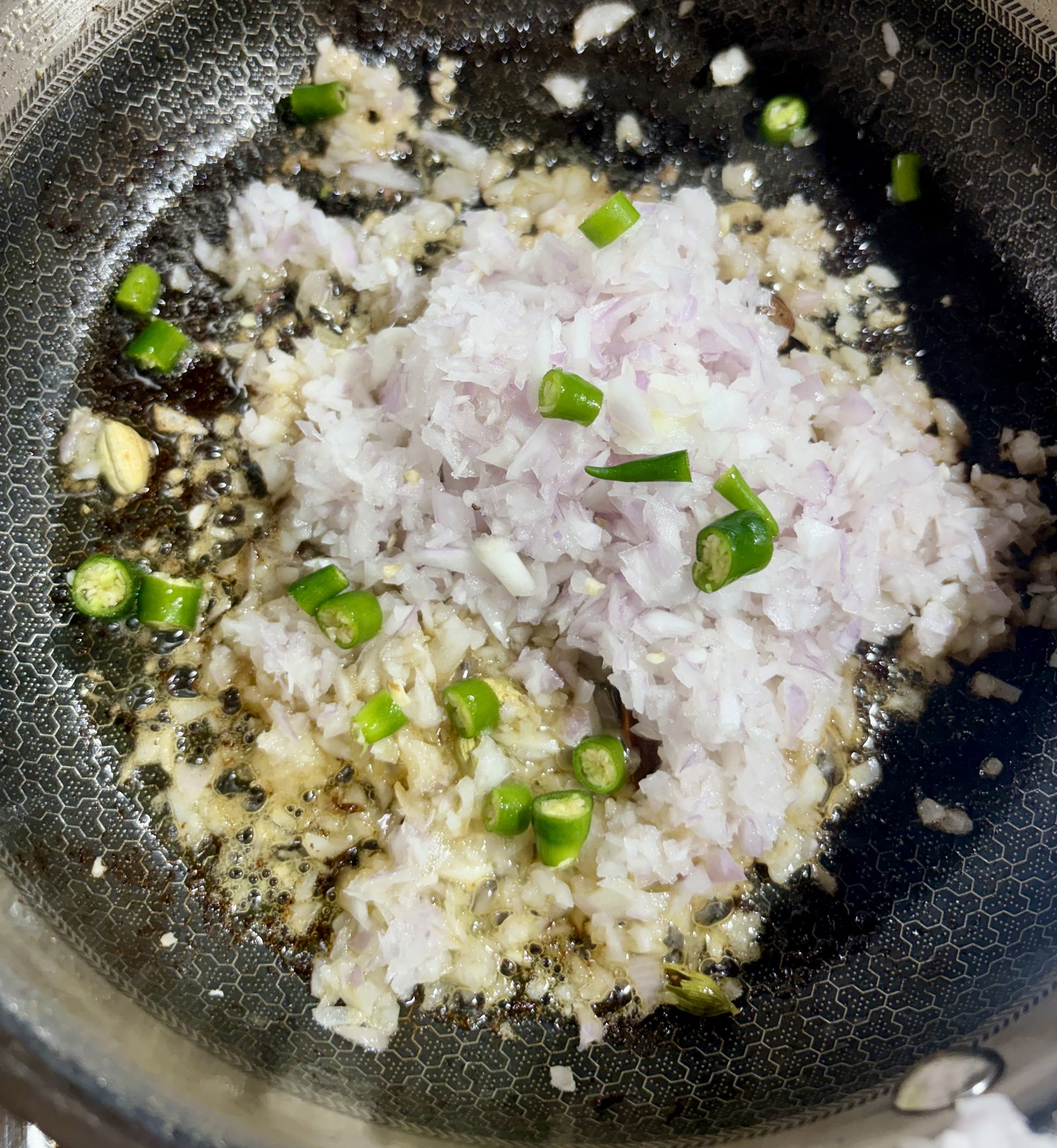 Step 4.1: Add the chopped onions and green chillies