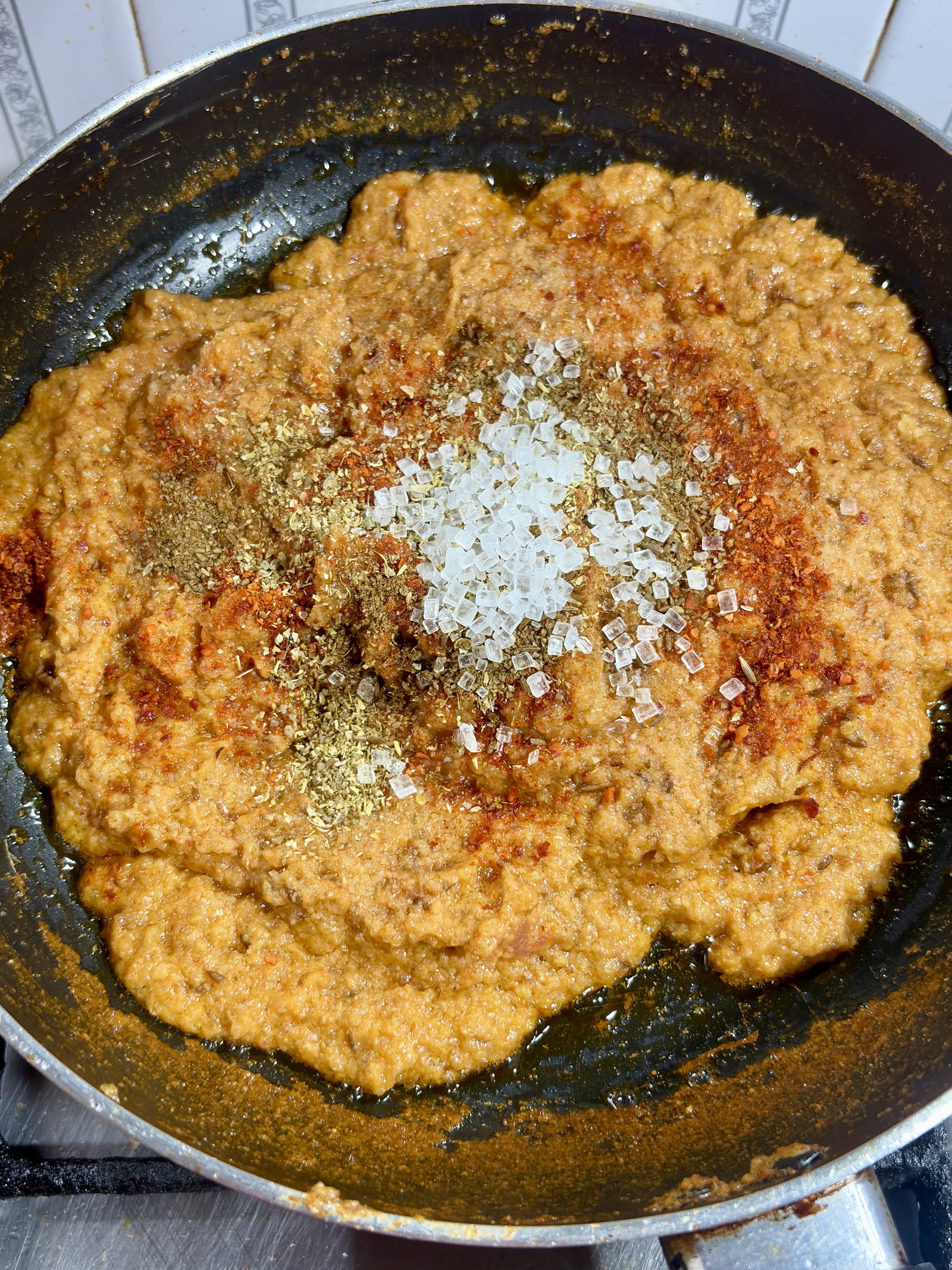 Step 4.1: Add the coriander powder, cumin powder, garam masala, red chilli powder, sugar, and salt