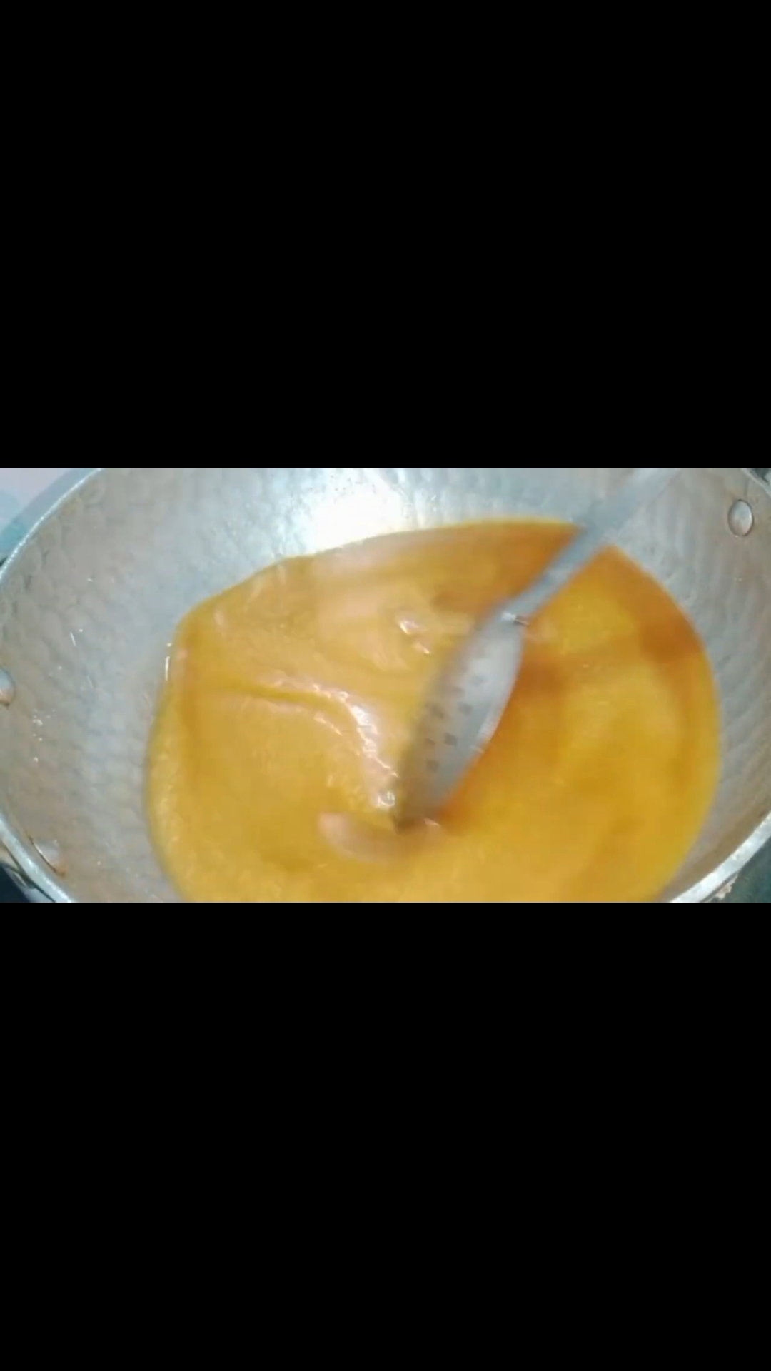 Step 5.1: Continue cooking and stirring until the mixture thickens and starts leaving the sides of the kadai