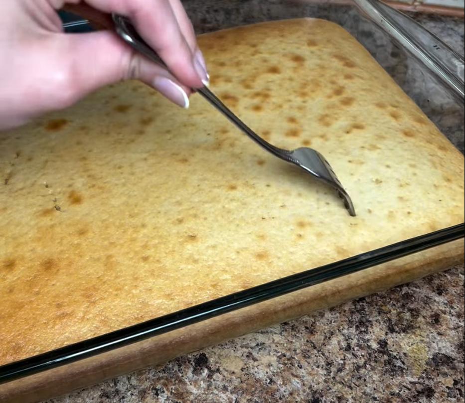 Step 2.1: Poke holes all over the cake using a fork and cover it in the vanilla milk