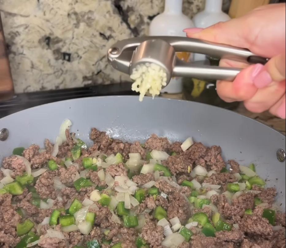 Step 1.1: Add olive oil to a pan and start browning ground beef until cooked through