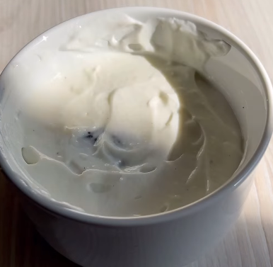 Step 1.1: Layer two soaked Oreo biscuits at the bottom of a small bowl or ramekin, then add a layer of the yoghurt mixture on top