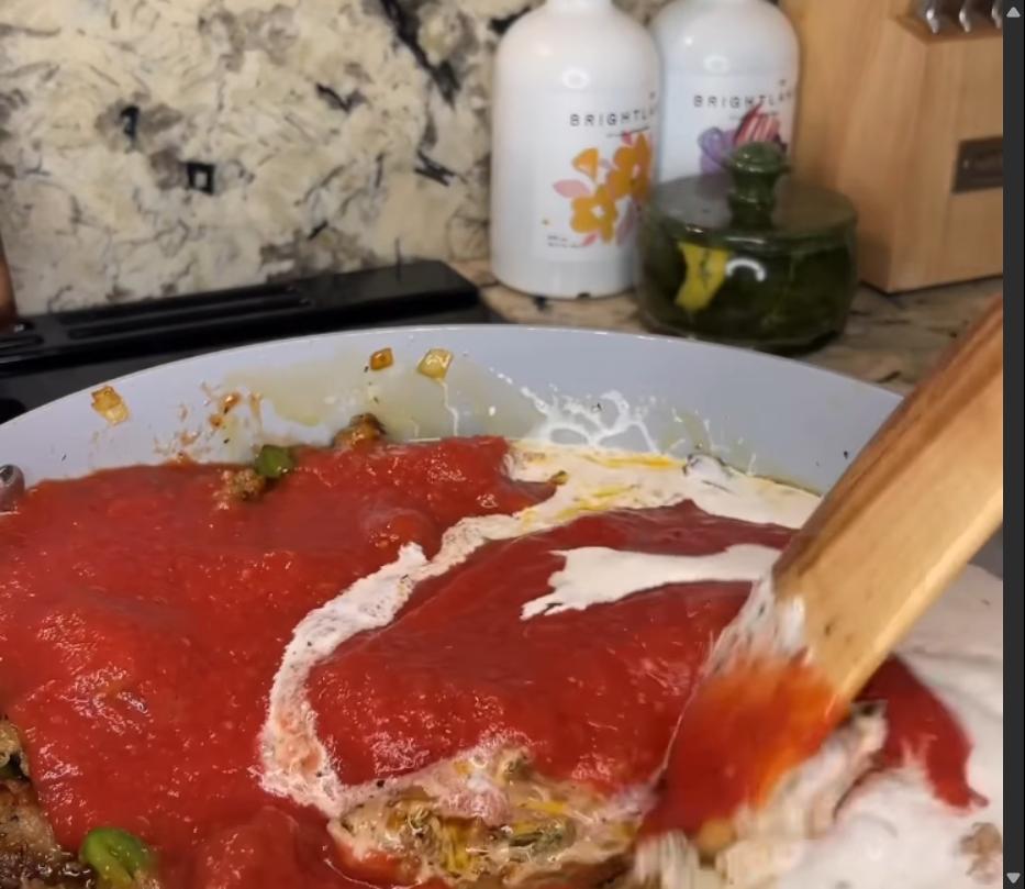 Step 1.1: Mix the seasonings, crushed tomatoes, and heavy whipping cream into the cooked Italian sausage mixture