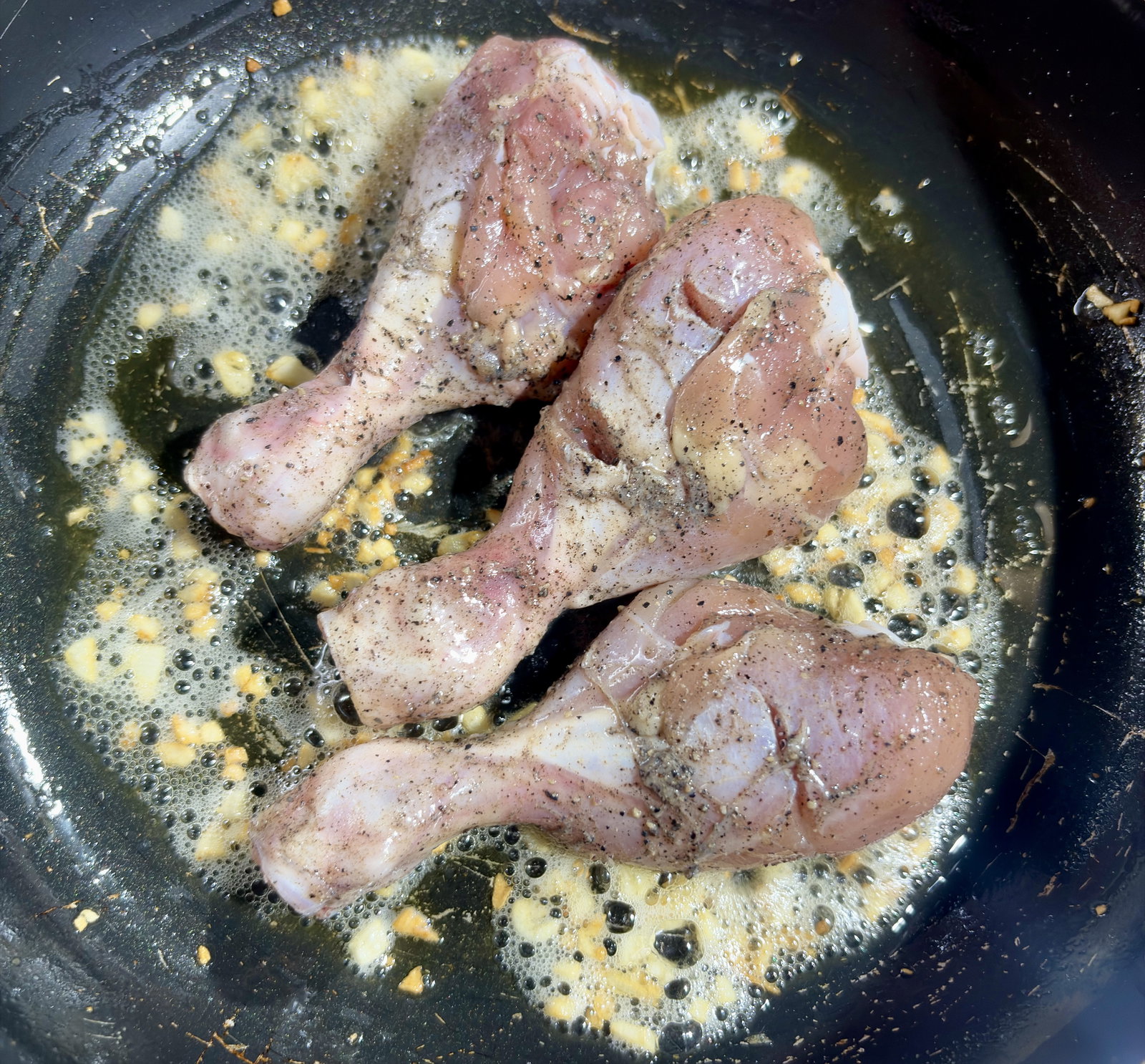 Step 3.1: Place the marinated chicken drumsticks into the pan
