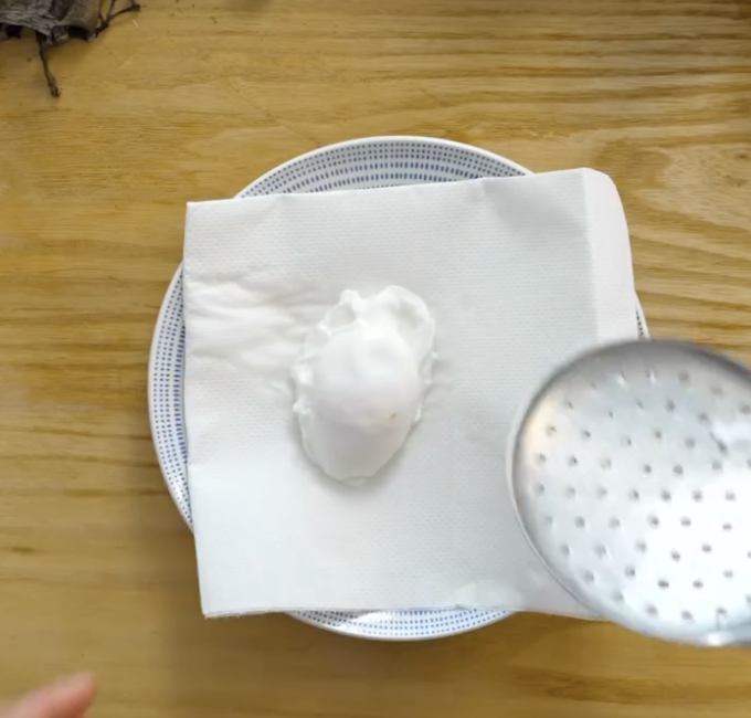 Step 2.1: Poach the eggs in simmering vinegar water for 3 minutes, then drain carefully