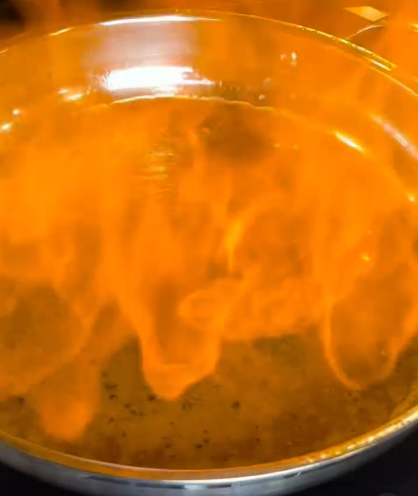 Step 2.1: In the same pan, carefully add cognac and reduce by half