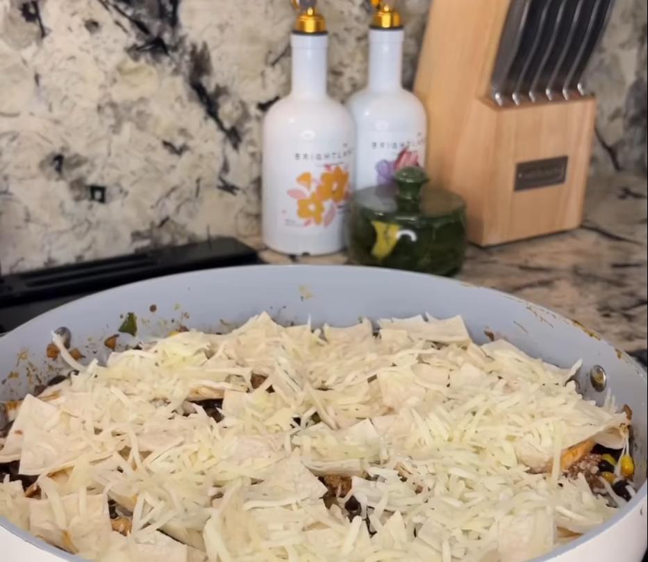 Step 1.1: Sprinkle the remaining tortilla squares on top along with shredded cheese