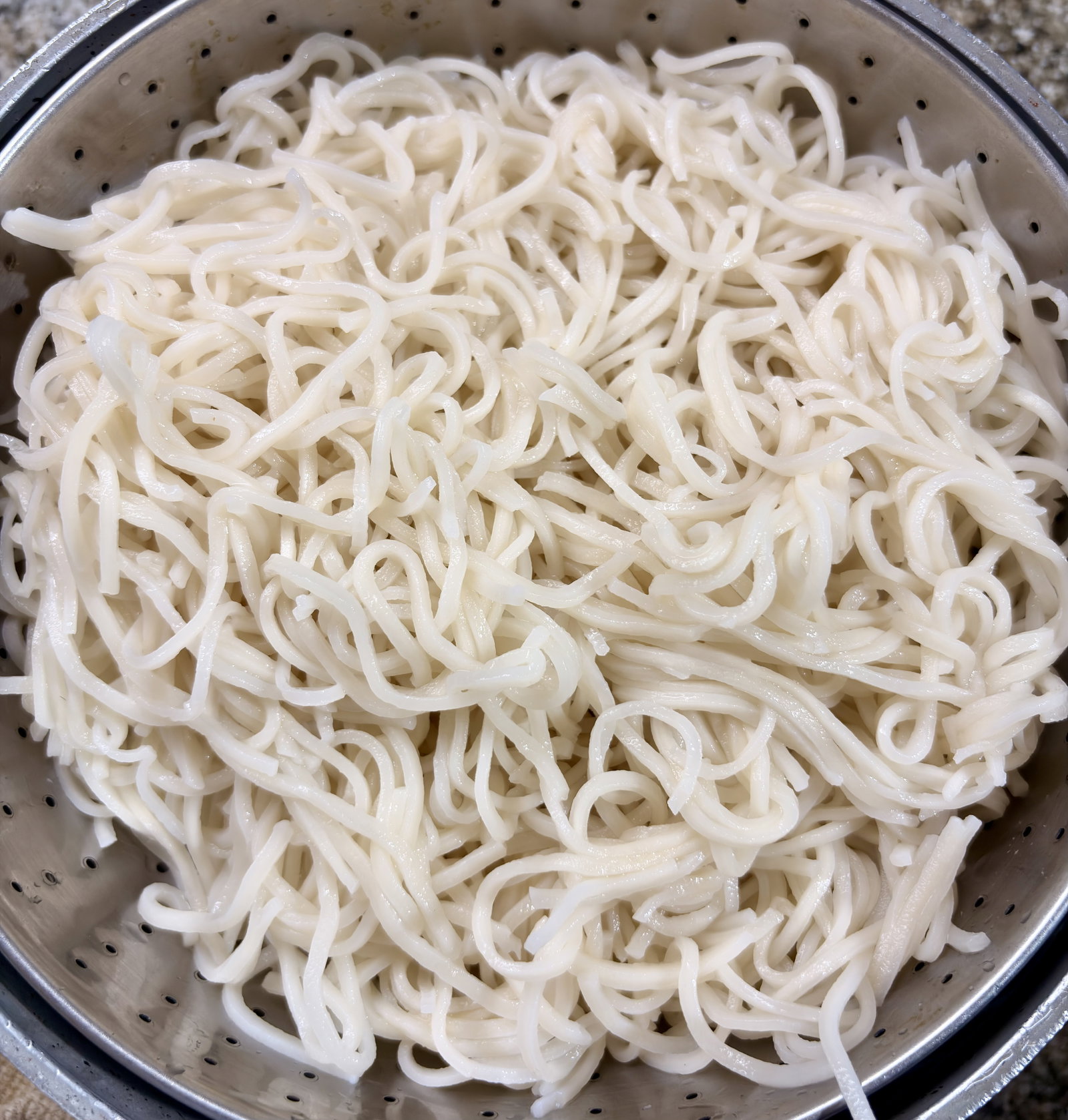 Step 2.1: Drain the noodles immediately and rinse under cold water to stop the cooking process