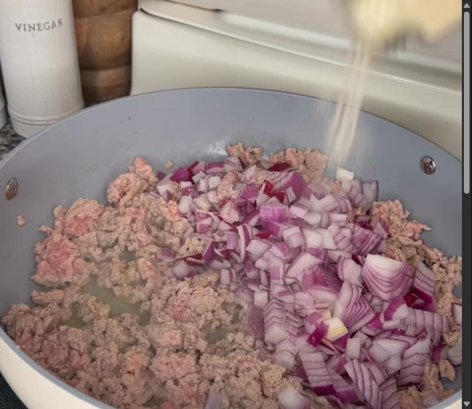 Step 1.1: Add red onion and seasonings (onion powder, garlic powder, paprika, salt, and pepper), and cook until onions are soft and fragrant