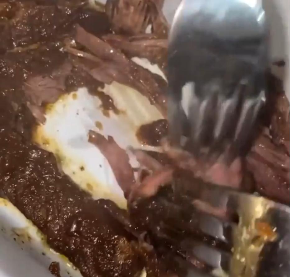 Step 1.1: Once cooked, pull the beef apart with two forks and mix with the sauce from the pot
