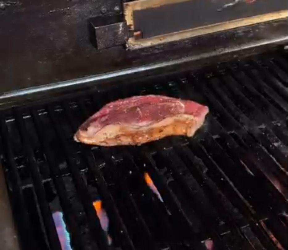 Step 4.1: Cook porterhouse steaks over high heat until desired doneness, then rest and slice