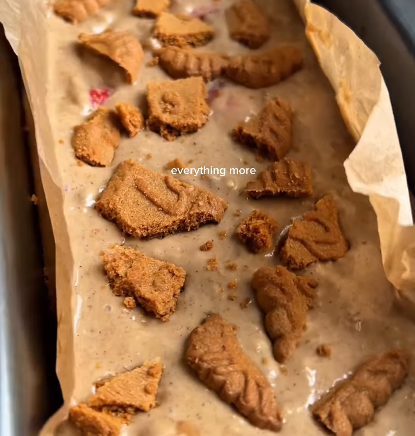 Step 1.1: Break the Biscoff biscuits into pieces and place them on top of the batter