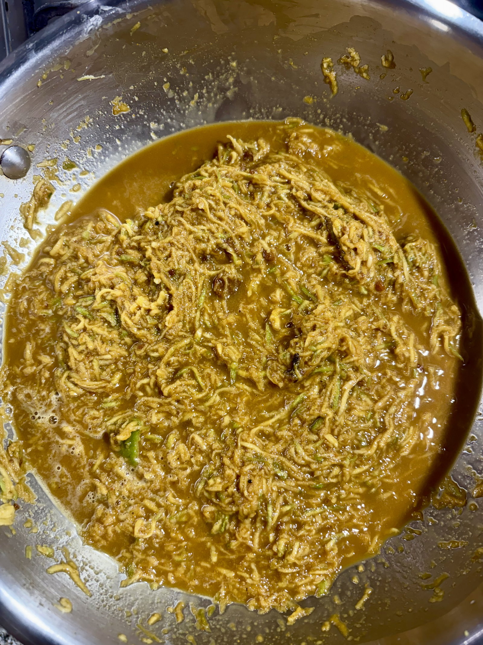 Step 2.2: Transfer the grated mangoes directly into a heavy-bottomed pan or kadhai