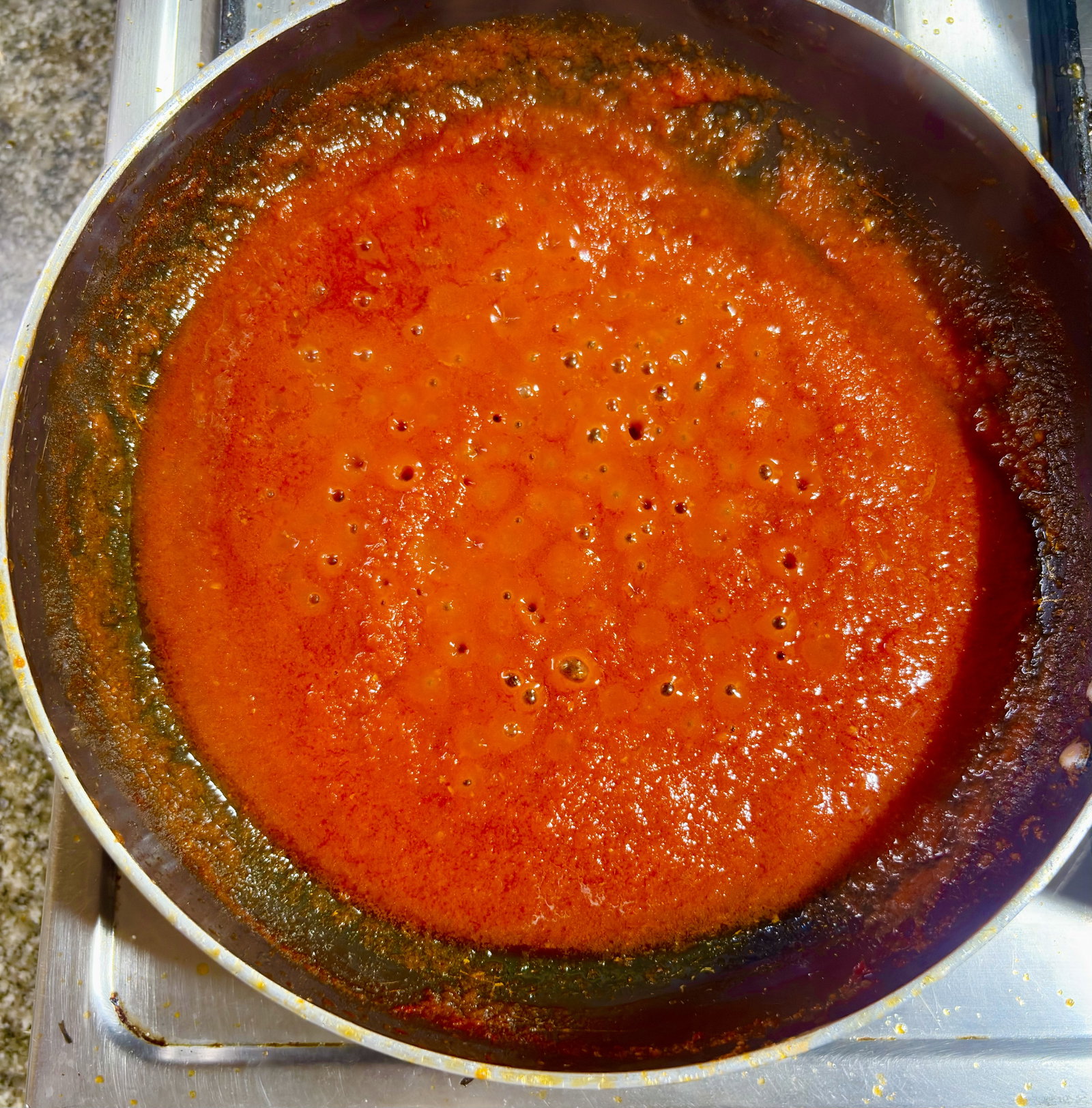 Step 3.2: Stir in Kashmiri red chilli powder, salt, and sugar, and cook on medium heat for 2–3 minutes