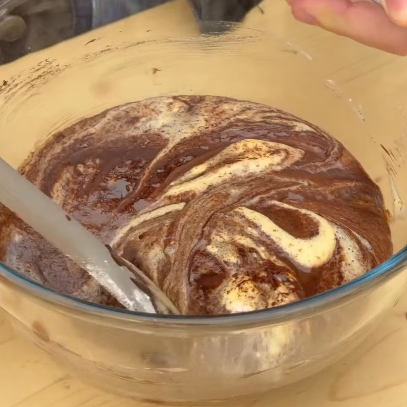 Step 1.2: Fold in the melted chocolate mixture, then gently add the flour