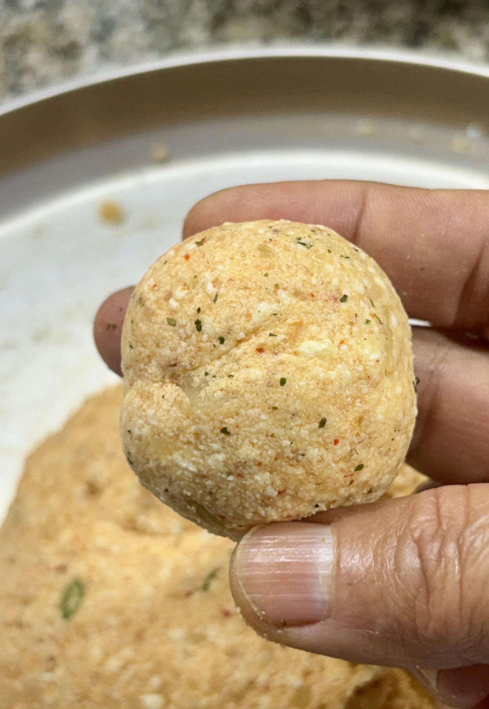 Step 1.1: **Shape: **Roll between your palms until perfectly smooth and crack-free to prevent bursting in oil