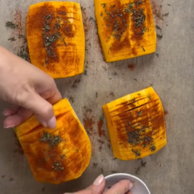 Step 1.1: Sprinkle smoked paprika, fresh thyme, salt, and pepper over the squash