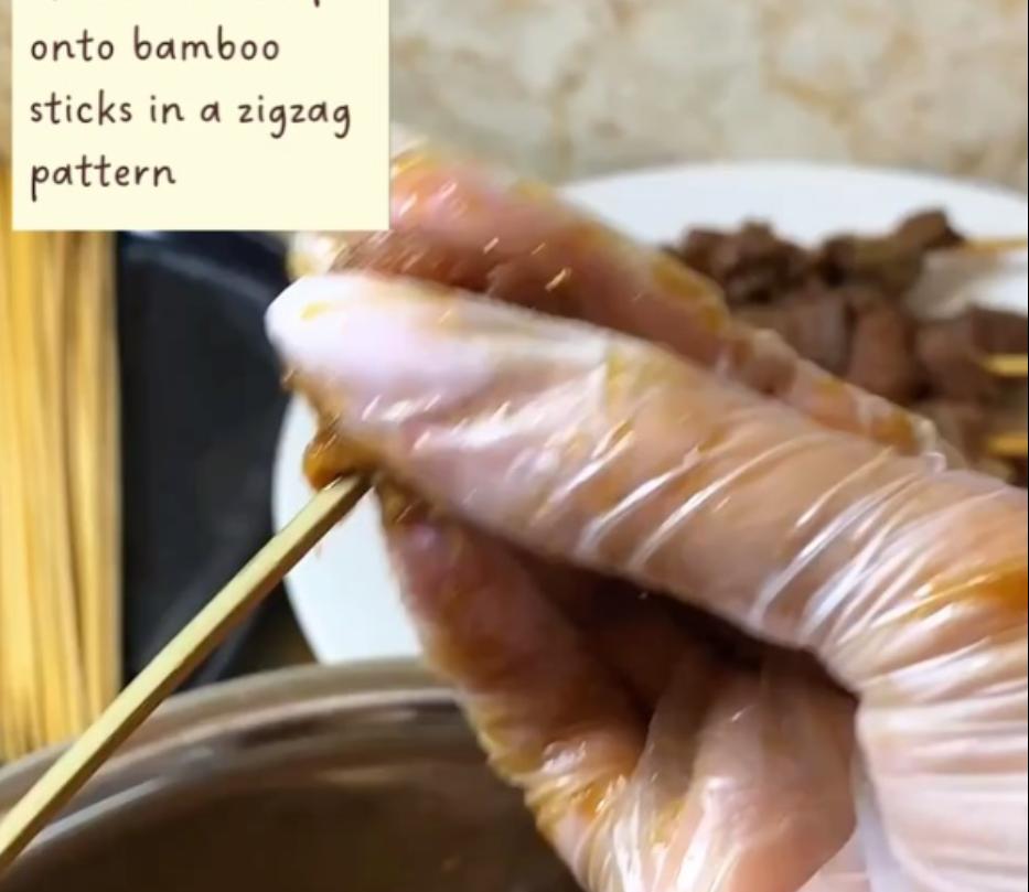 Step 1.1: Skewer the beef onto the bamboo sticks in a zigzag pattern