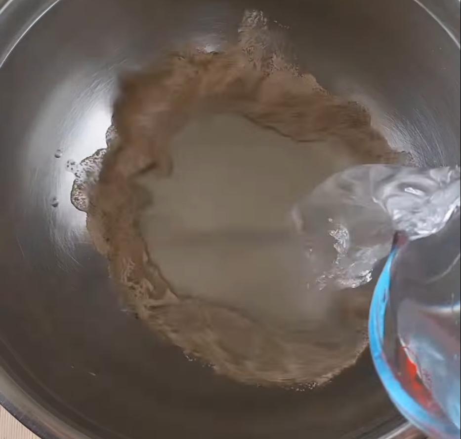 Step 1.1: Add the instant yeast and warm water to a bowl, mix and leave to stand for 1 minute