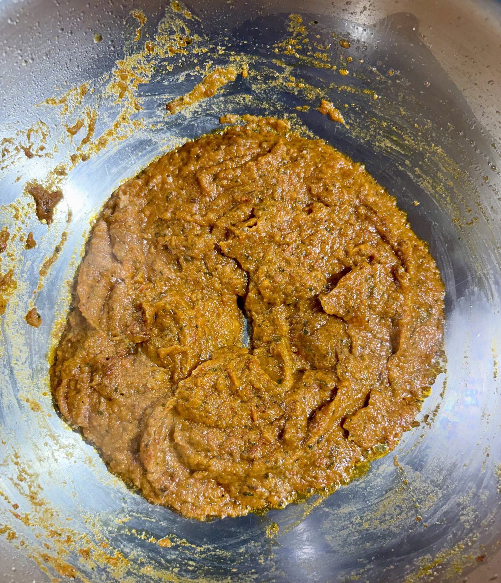 Step 4.2: Add the blended masala paste along with red chilli powder, coriander powder, cumin powder, turmeric, and salt