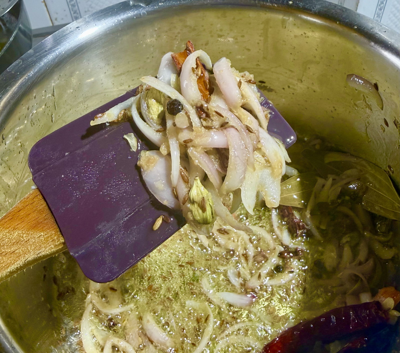 Step 1.2: Add the sliced onions and fry until soft and translucent