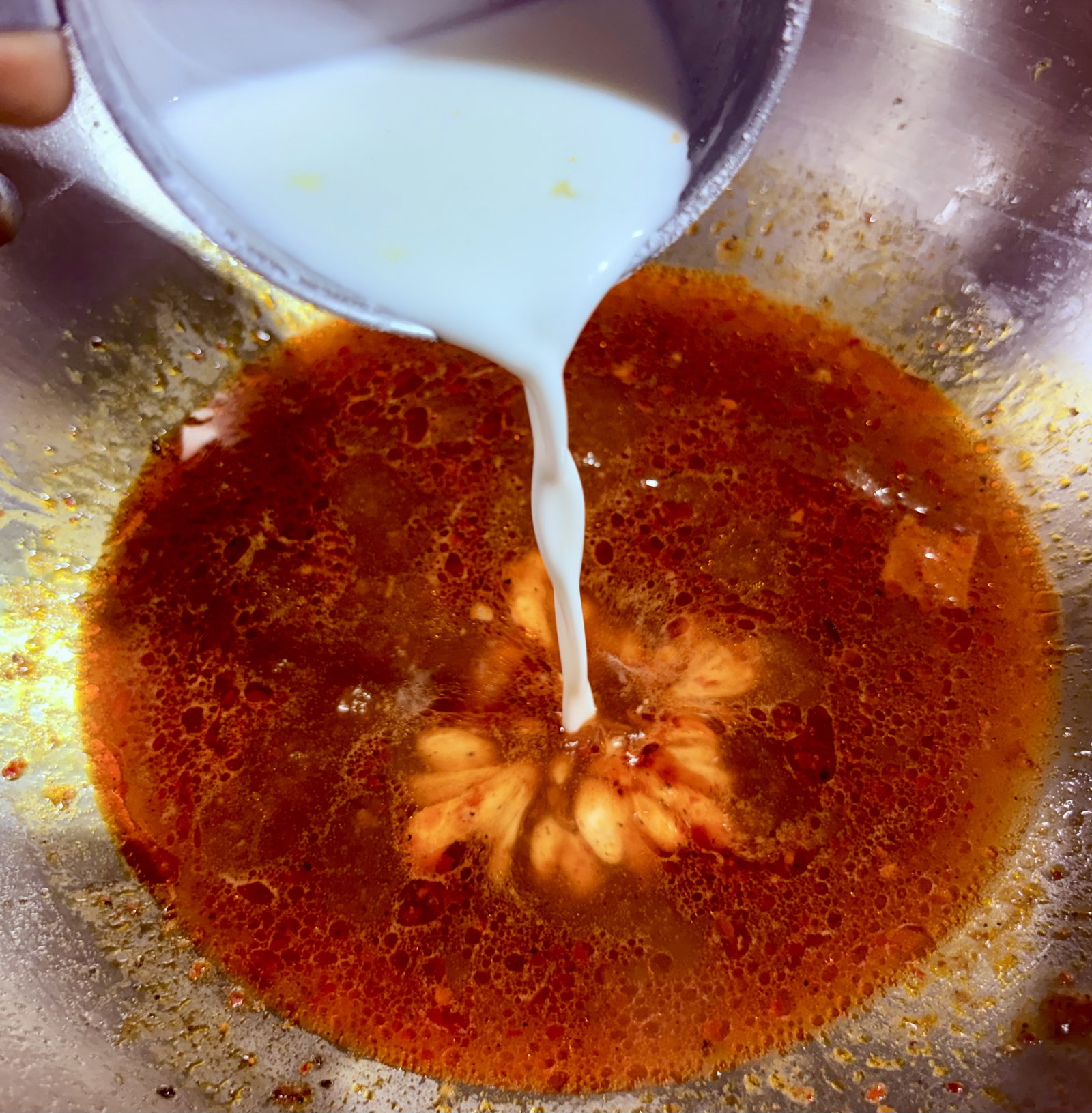 Step 3.1: Mix cornflour and water to make a slurry, then pour it into the simmering sauce