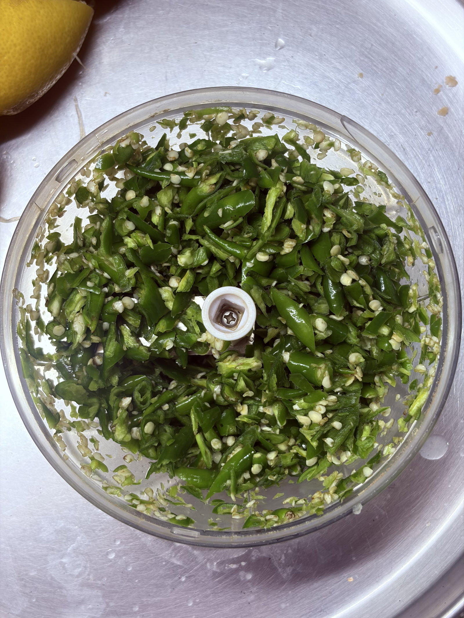 Step 1.1: Wash and thoroughly pat-dry the green chillies before chopping or crushing them in a mortar and pestle for a rustic texture