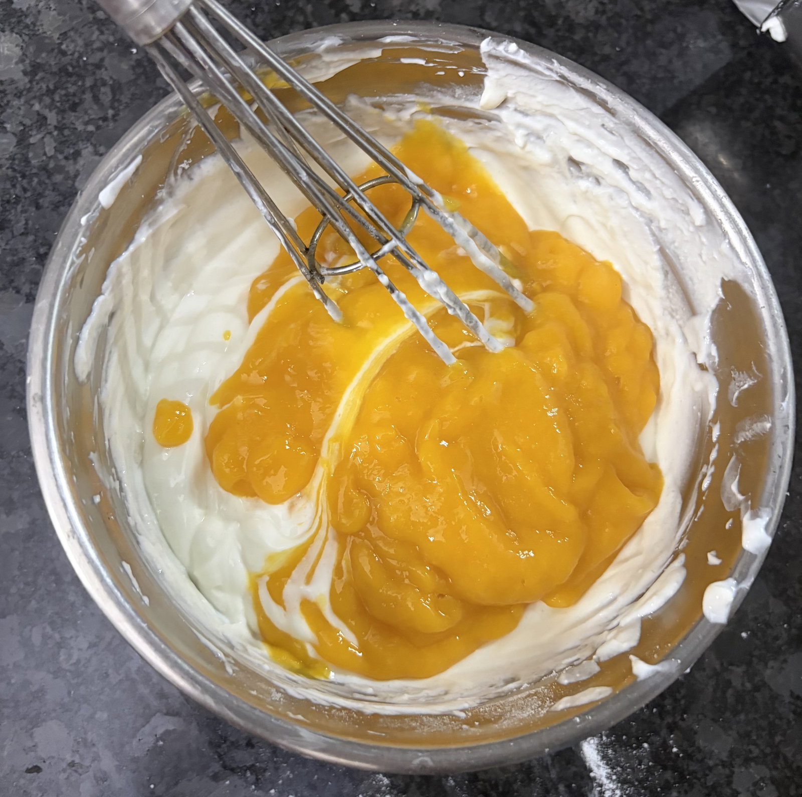 Step 3.1: Add the mango pulp and cardamom powder, if using