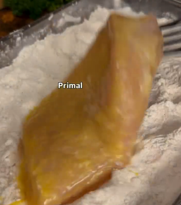 Step 2.1: Dredge the chicken breasts in the flour mixture, then dip into the egg wash, and coat again in the flour mixture