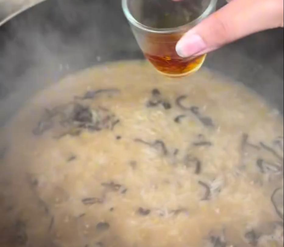 Step 3.1: Add some of the fried onions and saffron water, seal the lid, and drop the heat completely