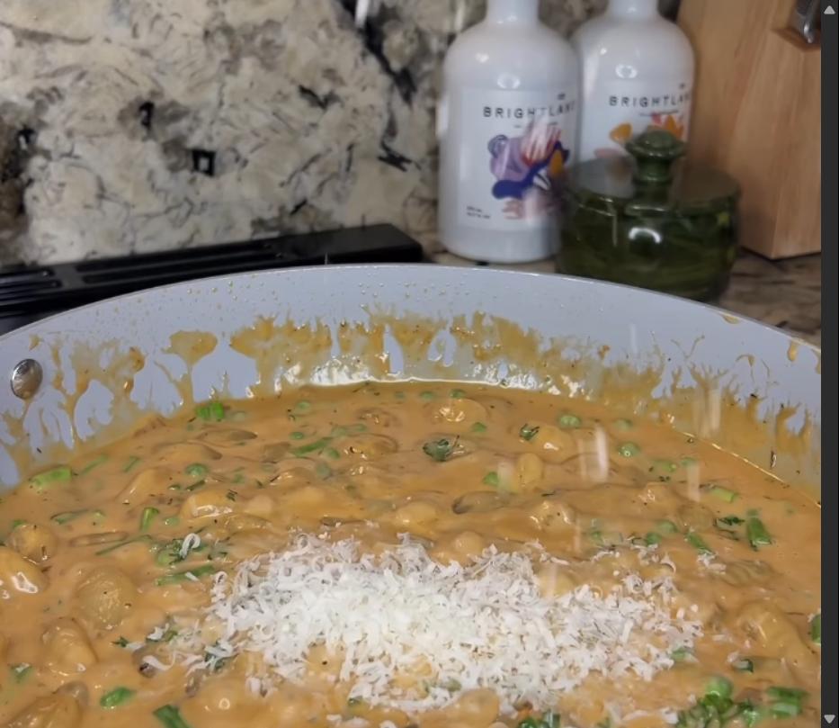 Step 3.1: Mix in chopped asparagus, frozen peas, parsley, and grated parmesan into the pan