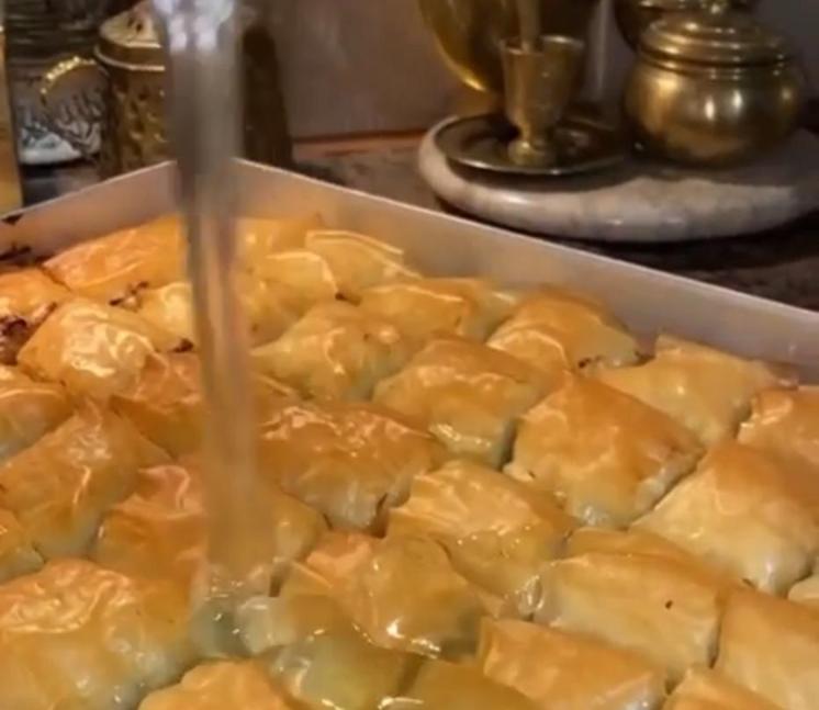 Step 1.1: For the simple syrup, bring the sugar, water, and lemon juice to a boil for around 45 minutes, then pour it over the hot baklava