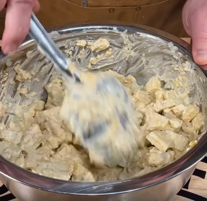 Step 2.1: Combine diced potatoes, sour cream, milk, ranch packet, cheddar cheese, and black pepper in a bowl