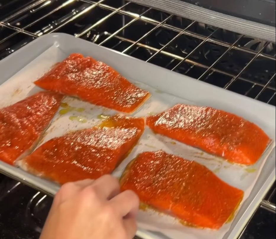 Step 1.1: Place the salmon on a baking sheet lined with parchment paper and bake for 15 minutes until the salmon is cooked through and flakes easily
