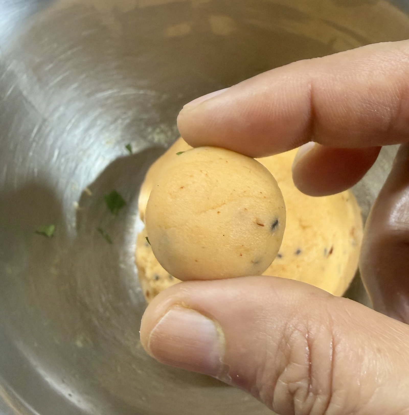 Step 3.1: Divide the dough into small, equal-sized portions and roll them into smooth balls