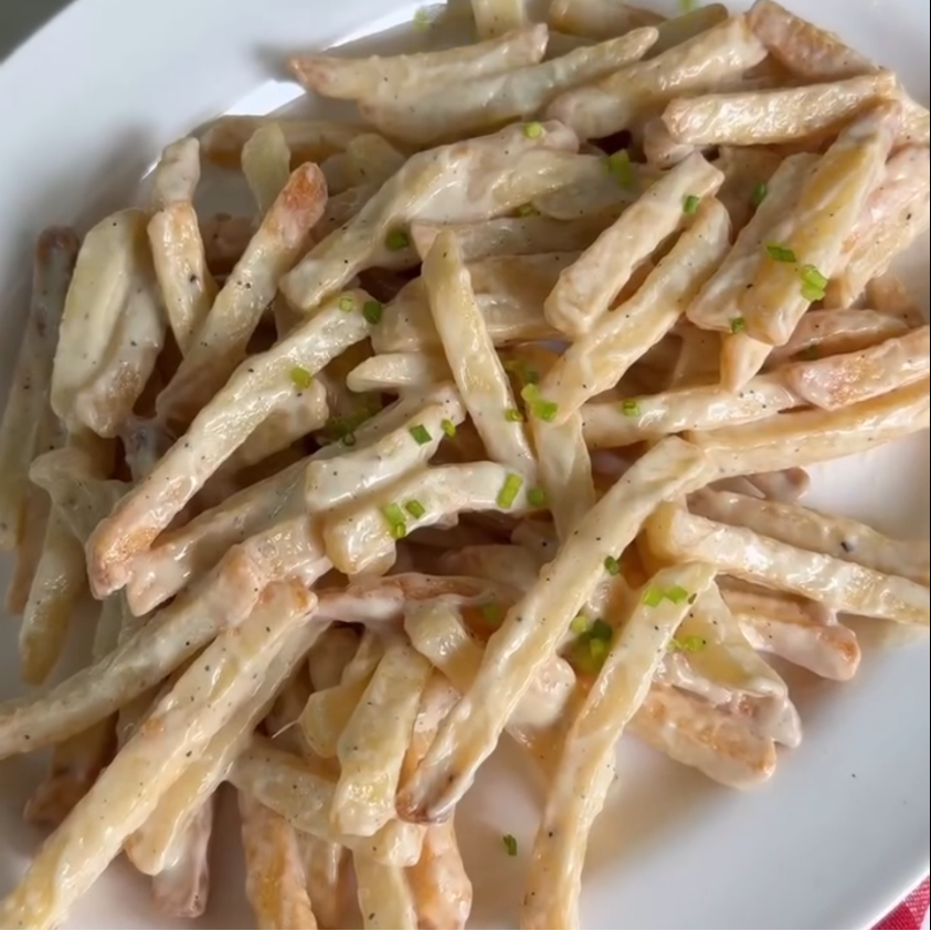 Step 2.1: Transfer to a plate and finish with extra Parmesan, chopped spring onion or garlic chives, freshly cracked black pepper, and a little chilli oil, chilli crisp, or fried garlic as desired