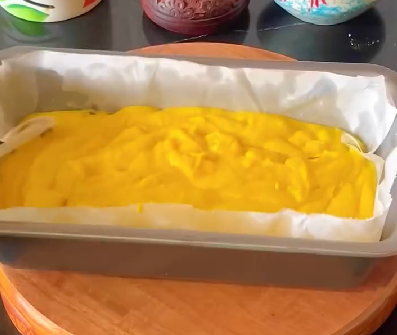 Step 1.1: Pour the batter into a greased tin