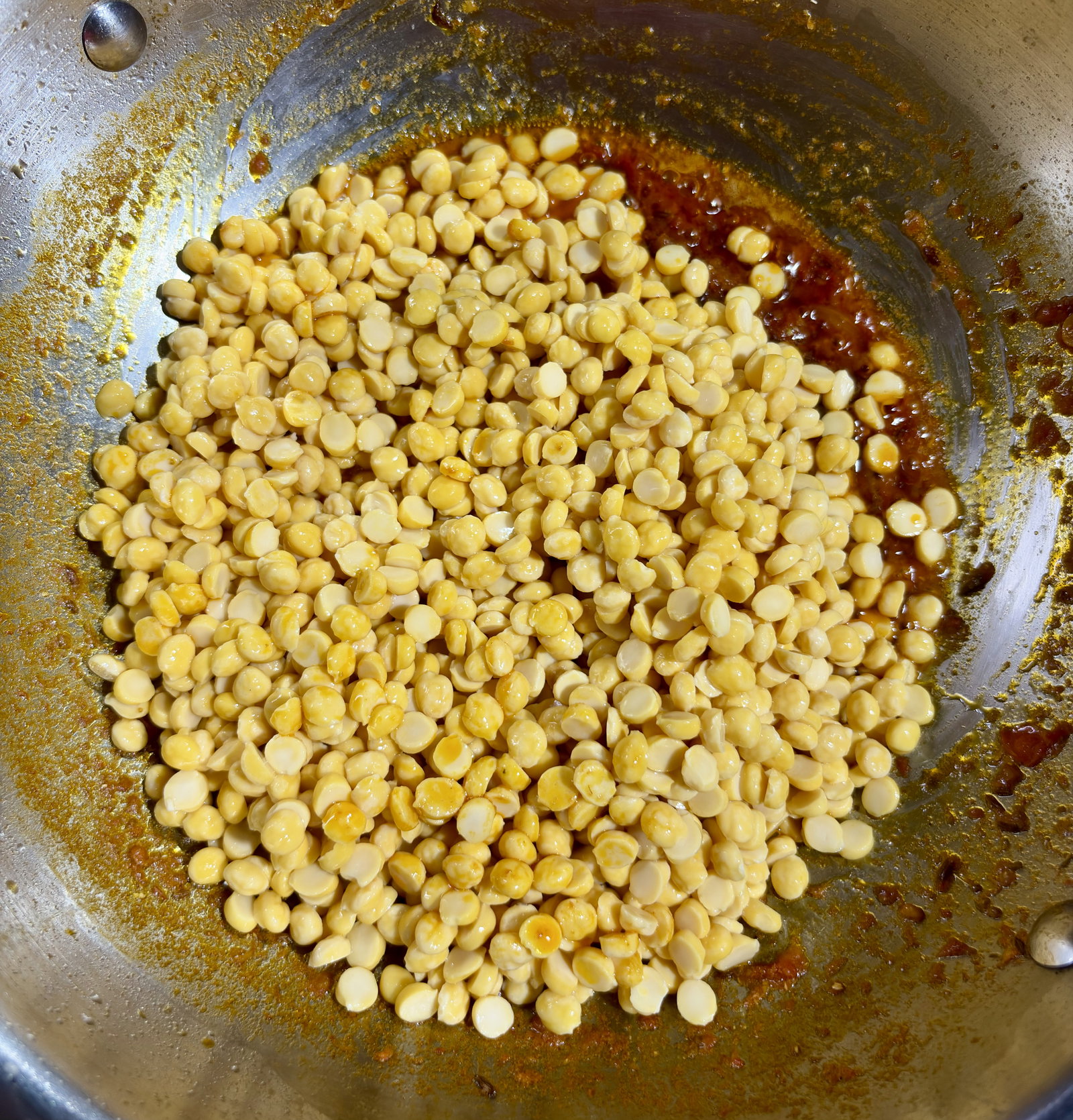 Step 4.1: Add the soaked chana dal and stir-fry for 3-4 minutes, ensuring every grain is coated with the masala