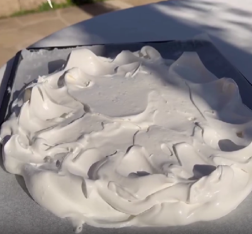 Step 1.1: Shape the meringue into a circle on a lined tray
