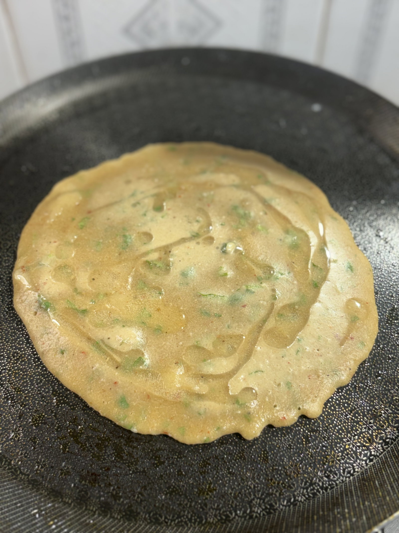 Step 1.1: **Cook until Set: **Drizzle a little oil around the edges and cook until the top looks dry and the edges begin to lift away from the pan