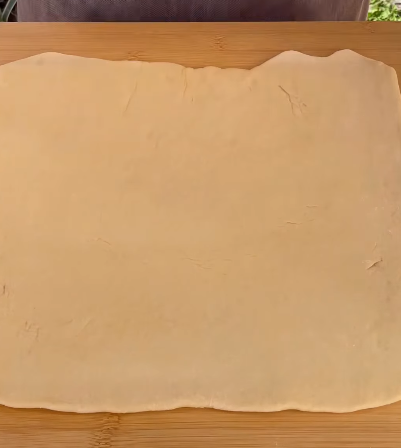 Step 1.1: Roll out the dough into a flat sheet