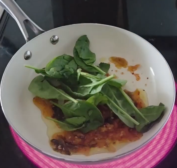 Step 1.1: Add kimchi and spinach to the pan