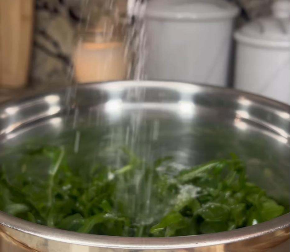 Step 1.1: Toss arugula with olive oil and salt