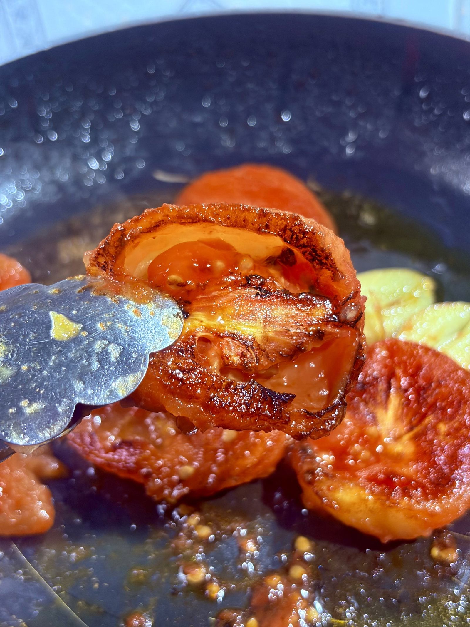 Step 1.2: Add the halved tomatoes (cut side down) and garlic cloves