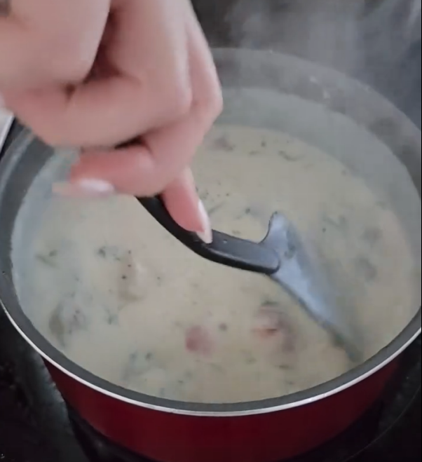 Step 1.1: Cook the sauce until it has thickened, then stir in the grated parmesan cheese and remove from heat