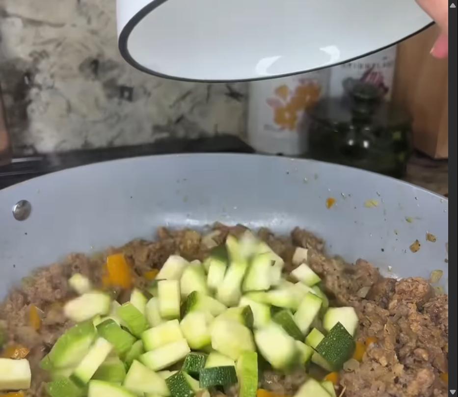 Step 2.1: Stir in the sliced zucchini and cook for another 2–3 minutes until tender