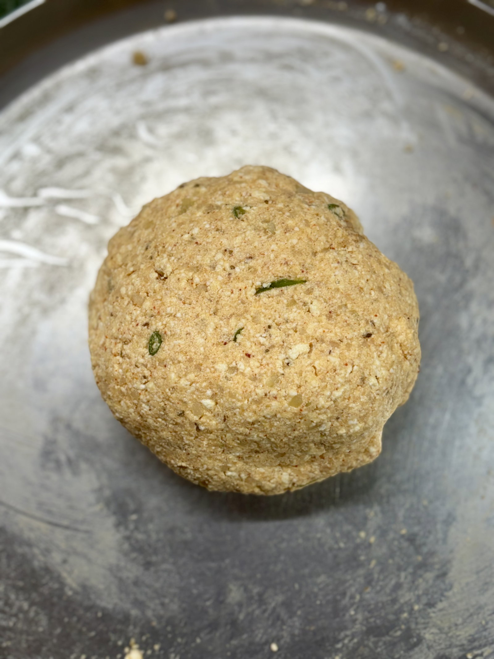 Step 1.1: **Mix: **In a large bowl, knead the grated paneer and potatoes with cornflour, coriander powder, cumin powder, Kashmiri chilli powder, salt, and green chilli to make a smooth dough
