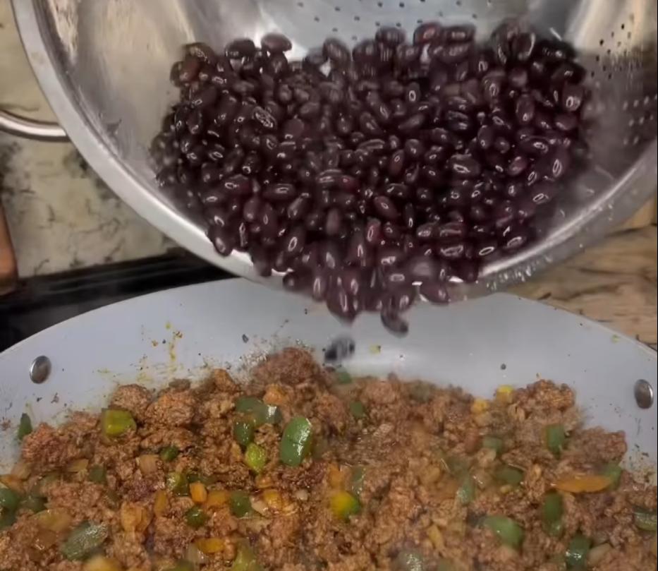 Step 1.1: Mix in citrus chili salt, oregano, chili powder, paprika, and cumin along with black beans, frozen corn, and enchilada sauce