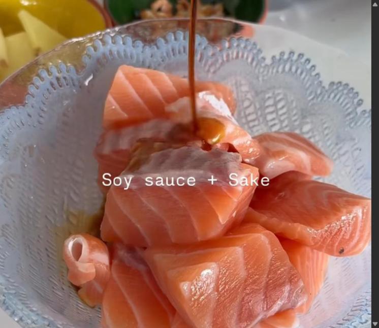 Step 1.1: Cut the salmon into chunky pieces, then add sake and soy sauce